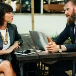 Man and Woman chatting at work